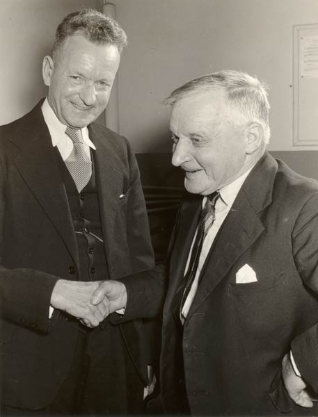 Photograph of Hugh Samuel King greeting a work colleague